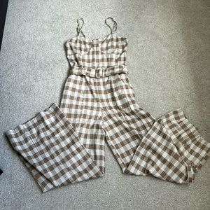 En Saison brown/cream checkered jumpsuit w detachable belt.  Adj straps.
